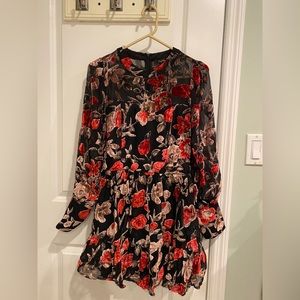 Brand new long sleeve velvet flower dress. Never worn. Perfect for the holidays.